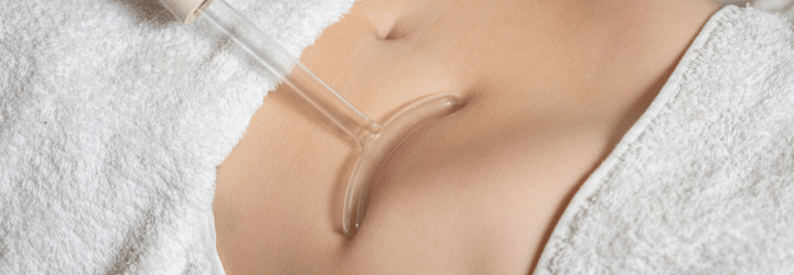 Female receiving an aesthetic treatment with radio frequency technique at an aesthetic center