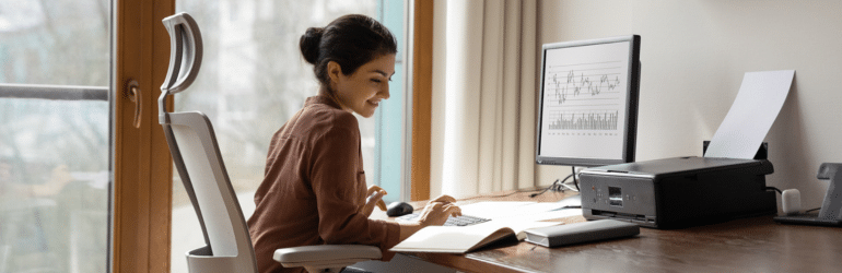 Concentrated indian woman working in home office