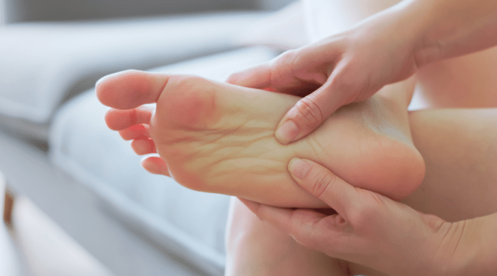 close up asian woman has foot pain and plantar fasciitis