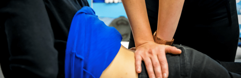 Woman receiving physiotherapy treatment on back