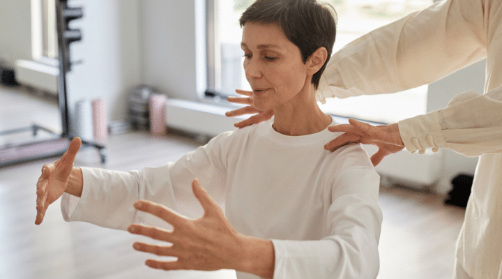Focused Senior Lady Doing Yoga Breathing Exercise