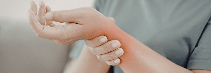 Physical Therapy Strategies for Managing Wrist Pain: Man holding his sprained wrist
