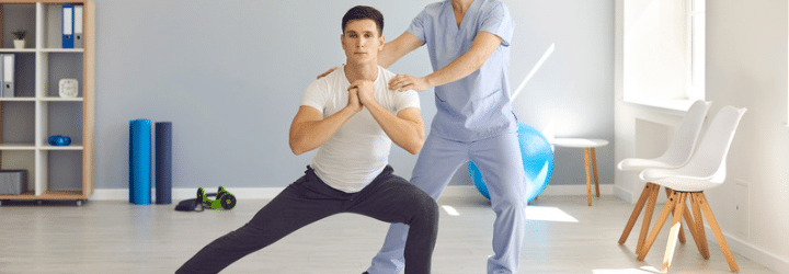 Physiotherapist helping patient balance